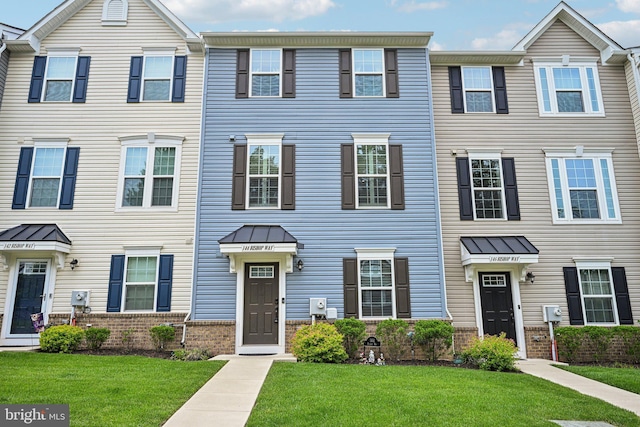 144 Bishop Way, Dublin, PA 18917 - multi unit property featuring brick siding, a front lawn, a standing seam roof, and metal roof