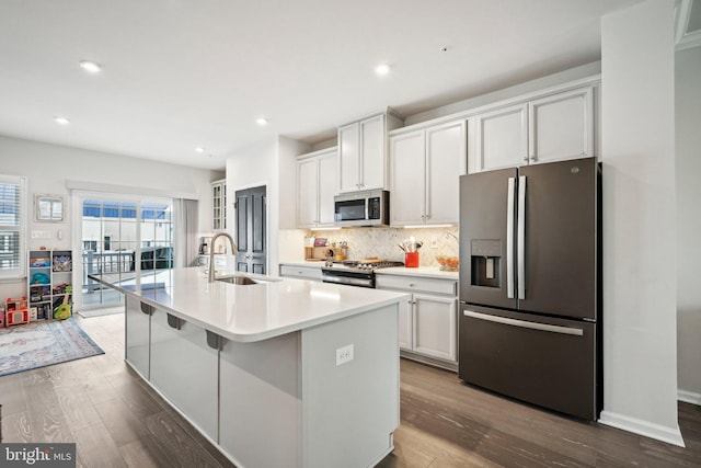 144 Bishop Way, Dublin, PA 18917 - kitchen with appliances with stainless steel finishes, a sink, dark wood-style flooring, a kitchen island with sink, and recessed lighting
