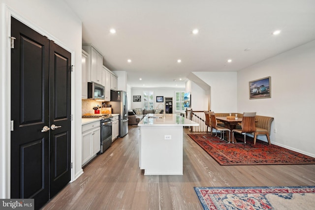 144 Bishop Way, Dublin, PA 18917 - kitchen with appliances with stainless steel finishes, open floor plan, light wood-type flooring, light countertops, and recessed lighting