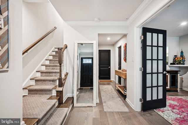 144 Bishop Way, Dublin, PA 18917 - entryway featuring wood finished floors, stairway, baseboards, and crown molding