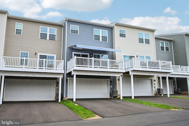 144 Bishop Way, Dublin, PA 18917 - back of house with a garage, driveway, and central AC