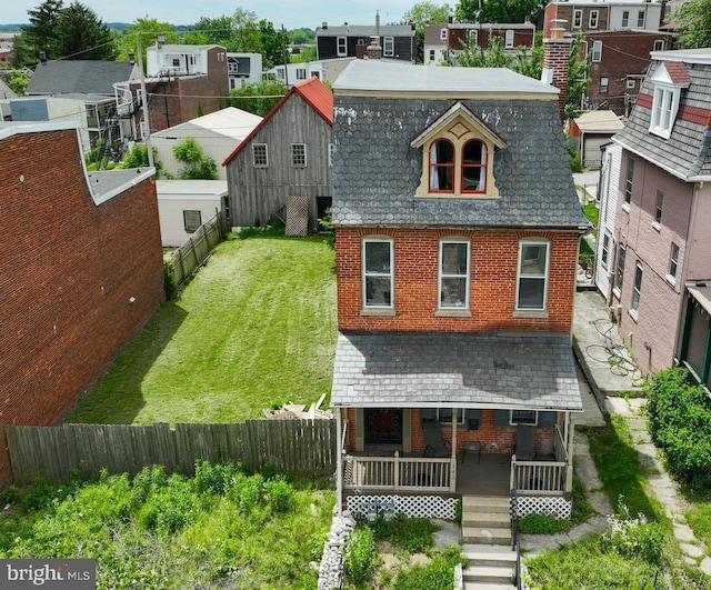 342 N Newberry St, York, PA 17401 - view of front of property with brick siding, a fenced backyard, and covered porch