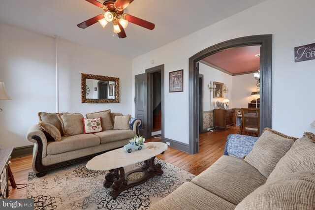 342 N Newberry St, York, PA 17401 - living area featuring hardwood / wood-style floors, a ceiling fan, arched walkways, and baseboards
