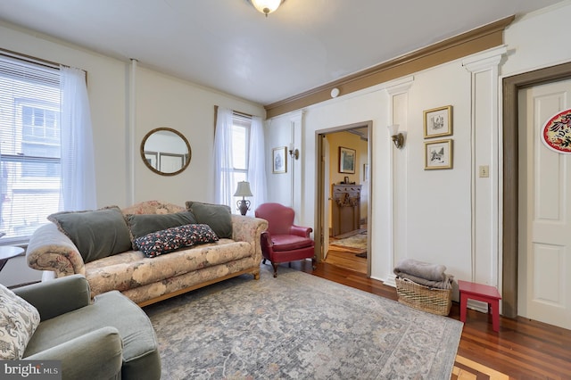 342 N Newberry St, York, PA 17401 - living area featuring wood finished floors and ornate columns