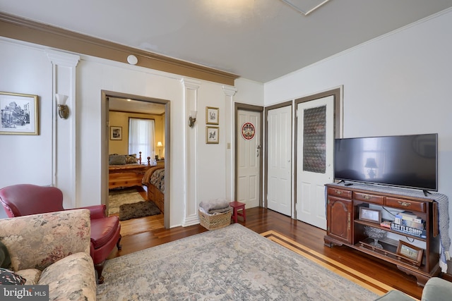 342 N Newberry St, York, PA 17401 - living area featuring decorative columns, dark wood finished floors, and ornamental molding