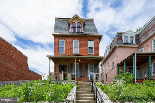 342 N Newberry St, York, PA 17401 - victorian home featuring mansard roof, a high end roof, brick siding, covered porch, and stairway