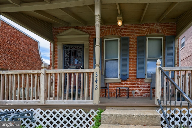 342 N Newberry St, York, PA 17401 - view of exterior entry featuring brick siding and a porch