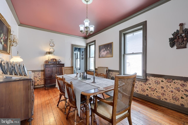 342 N Newberry St, York, PA 17401 - dining area featuring a chandelier, crown molding, light wood finished floors, and baseboards