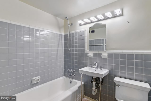 4200 Cathedral Ave NW Unit 317, Washington, DC 20016 - bathroom with toilet, tile walls, shower / washtub combination, and a sink