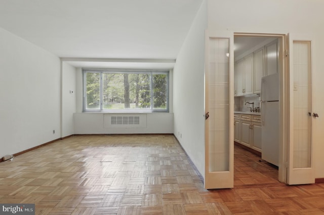 4200 Cathedral Ave NW Unit 317, Washington, DC 20016 - unfurnished room featuring french doors, baseboards, and a sink