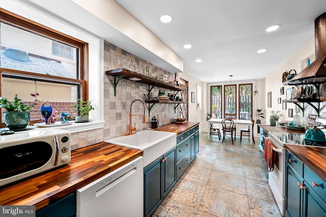 522 S Hanover St, Baltimore, MD 21201 - kitchen featuring wood counters, white appliances, open shelves, a sink, and tasteful backsplash