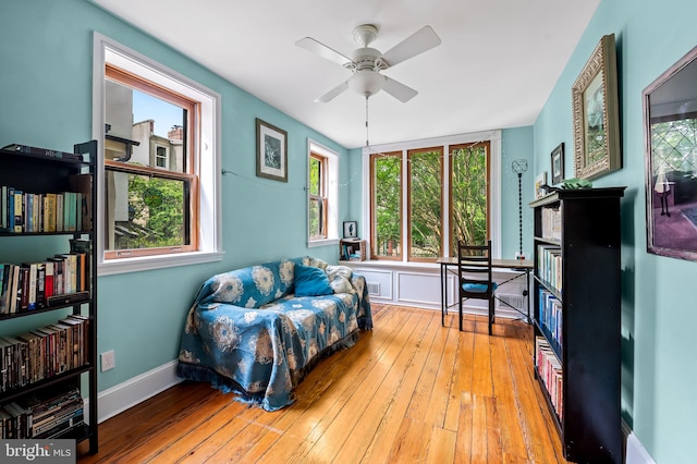 522 S Hanover St, Baltimore, MD 21201 - living area with ceiling fan, hardwood / wood-style floors, and baseboards