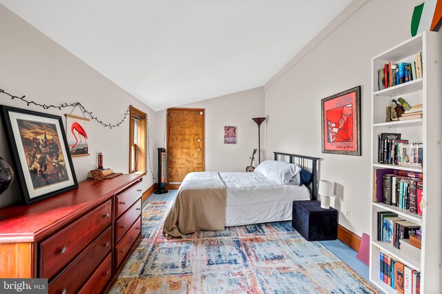 522 S Hanover St, Baltimore, MD 21201 - bedroom featuring vaulted ceiling, baseboards, and wood finished floors