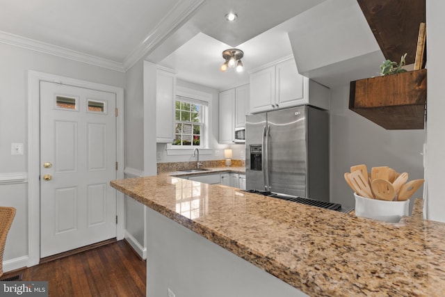 823 Church St, Alexandria, VA 22314 - kitchen with appliances with stainless steel finishes, a sink, dark wood-type flooring, white cabinets, and light stone counters