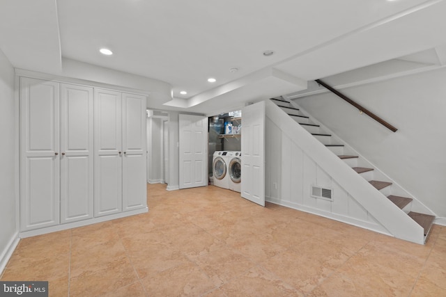 823 Church St, Alexandria, VA 22314 - finished below grade area with washing machine and dryer, recessed lighting, stairway, baseboards, and light tile patterned floors