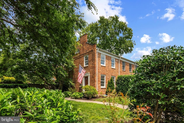 823 Church St, Alexandria, VA 22314 - view of front facade with a chimney and brick siding