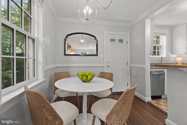 823 Church St, Alexandria, VA 22314 - dining area featuring a chandelier, dark wood finished floors, ornamental molding, and wainscoting