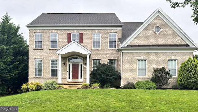 124 Willow Grove Mill Dr, Middletown, DE 19709 - colonial inspired home with brick siding and a front yard