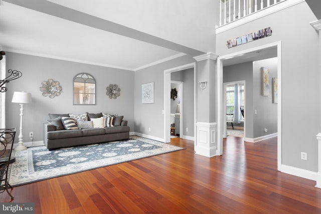 124 Willow Grove Mill Dr, Middletown, DE 19709 - living area featuring ornate columns, wood finished floors, ornamental molding, and baseboards