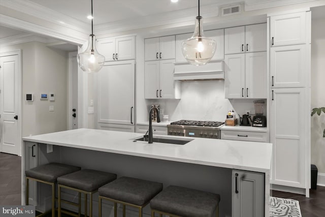 1775 Church St NW Unit 8, Washington, DC 20036 - kitchen with custom range hood, a sink, white cabinetry, a breakfast bar, and crown molding