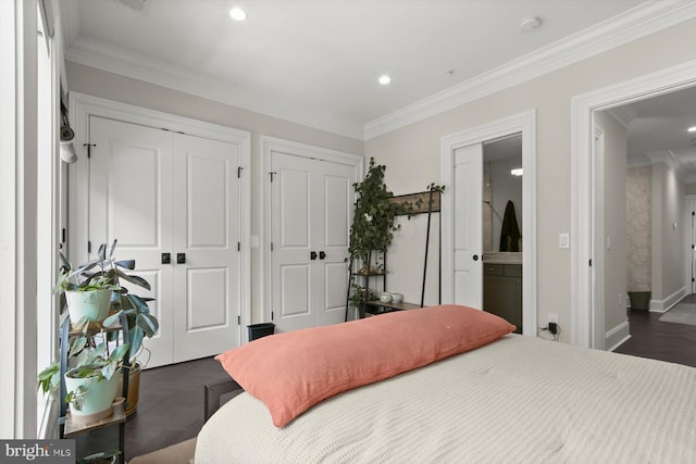 1775 Church St NW Unit 8, Washington, DC 20036 - bedroom with two closets, crown molding, recessed lighting, baseboards, and connected bathroom