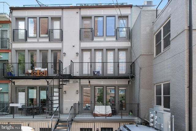 1775 Church St NW Unit 8, Washington, DC 20036 - back of house with stairs and stucco siding