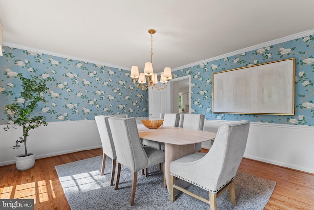 3713 Templeton Pl, Alexandria, VA 22304 - dining area featuring a chandelier, wallpapered walls, wood finished floors, ornamental molding, and baseboards