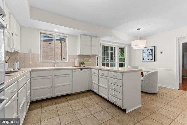 3713 Templeton Pl, Alexandria, VA 22304 - kitchen featuring white appliances, a peninsula, backsplash, white cabinetry, and recessed lighting