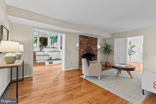 3713 Templeton Pl, Alexandria, VA 22304 - living room with light wood-style flooring, a fireplace, and baseboards