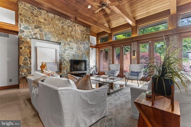 3713 Templeton Pl, Alexandria, VA 22304 - living area featuring wood ceiling with exposed beams, a stone fireplace, baseboards, ceiling fan, and a high ceiling
