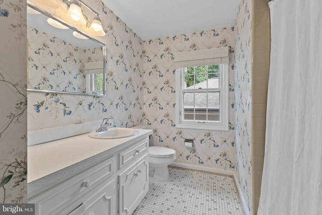 3713 Templeton Pl, Alexandria, VA 22304 - bathroom featuring vanity, toilet, tile patterned floors, baseboards, and wallpapered walls