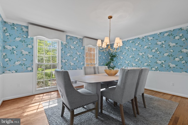 3713 Templeton Pl, Alexandria, VA 22304 - dining space with wallpapered walls, a chandelier, crown molding, light wood finished floors, and baseboards