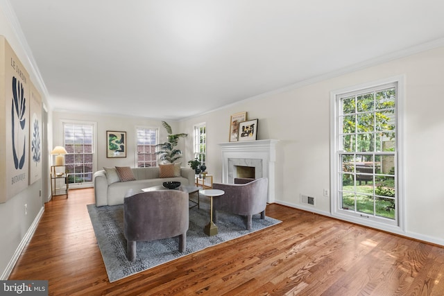 3713 Templeton Pl, Alexandria, VA 22304 - living room featuring wood finished floors, baseboards, crown molding, and a fireplace