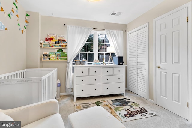 2050 N Calvert St Unit 106, Arlington, VA 22201 - bedroom featuring light colored carpet, a nursery area, and a closet