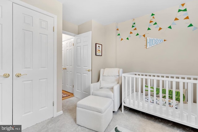 2050 N Calvert St Unit 106, Arlington, VA 22201 - bedroom with a crib and carpet flooring