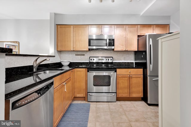 2050 N Calvert St Unit 106, Arlington, VA 22201 - kitchen featuring stainless steel appliances, backsplash, and dark stone countertops