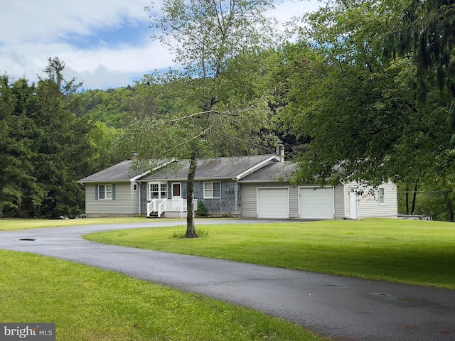 288 River Rd, Beach Lake, PA 18405 - single story home featuring asphalt driveway, an attached garage, a front yard, and a chimney