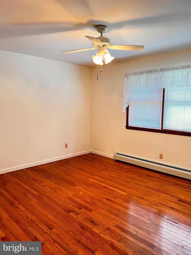 288 River Rd, Beach Lake, PA 18405 - unfurnished room featuring wood finished floors, a baseboard radiator, ceiling fan, and baseboards