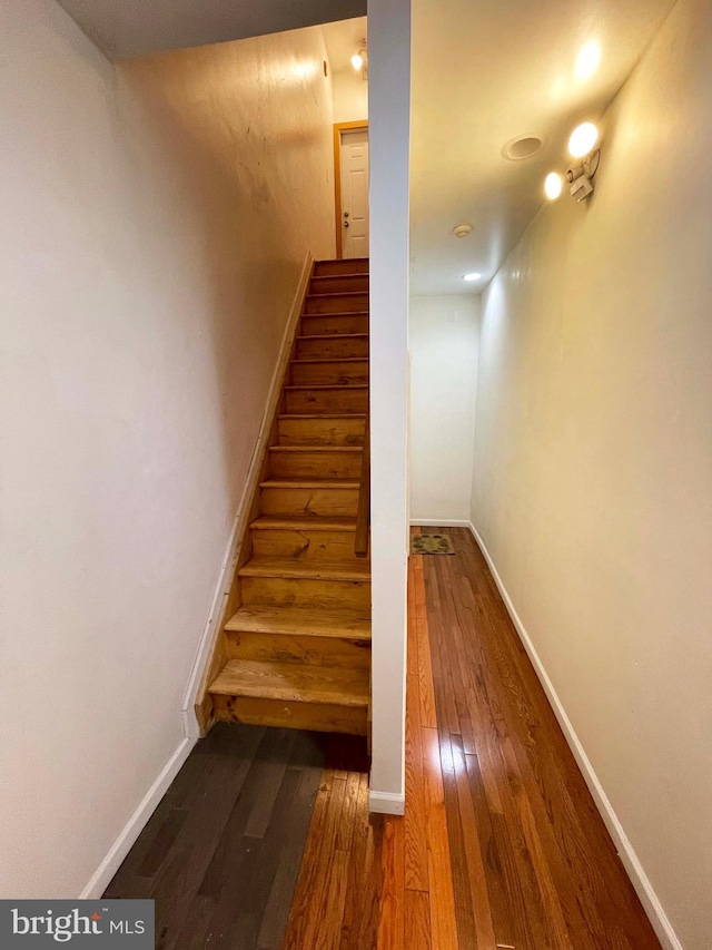 3647 N 19th St, Philadelphia, PA 19140 - staircase featuring hardwood / wood-style flooring and baseboards