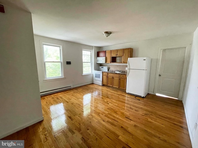 3647 N 19th St, Philadelphia, PA 19140 - kitchen with white appliances, a baseboard radiator, light wood-style flooring, brown cabinetry, and decorative backsplash
