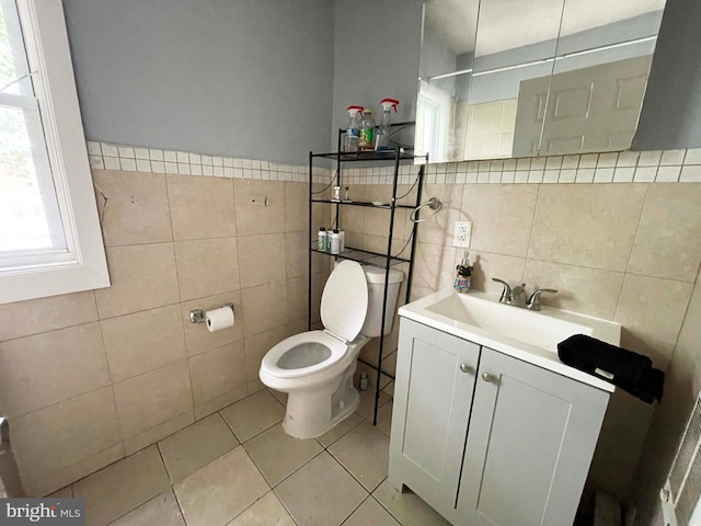 3647 N 19th St, Philadelphia, PA 19140 - bathroom with tile walls, toilet, vanity, tile patterned flooring, and a shower