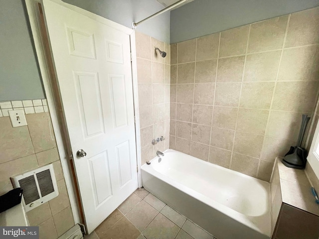 3647 N 19th St, Philadelphia, PA 19140 - bathroom featuring tile walls, tile patterned floors, shower / tub combination, and heating unit
