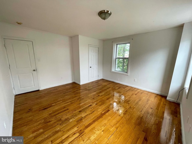 3647 N 19th St, Philadelphia, PA 19140 - unfurnished bedroom with wood-type flooring, baseboards, and a closet