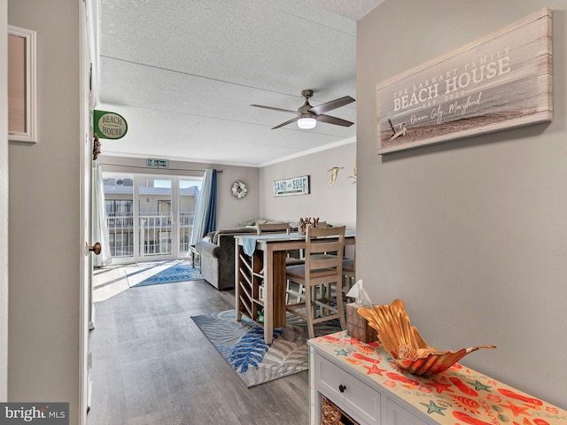 4711 Coastal Hwy Unit 538, Ocean City, MD 21842 - hall featuring a textured ceiling, wood finished floors, and crown molding