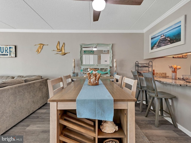 4711 Coastal Hwy Unit 538, Ocean City, MD 21842 - dining area featuring wood finished floors, ceiling fan, a textured ceiling, ornamental molding, and baseboards