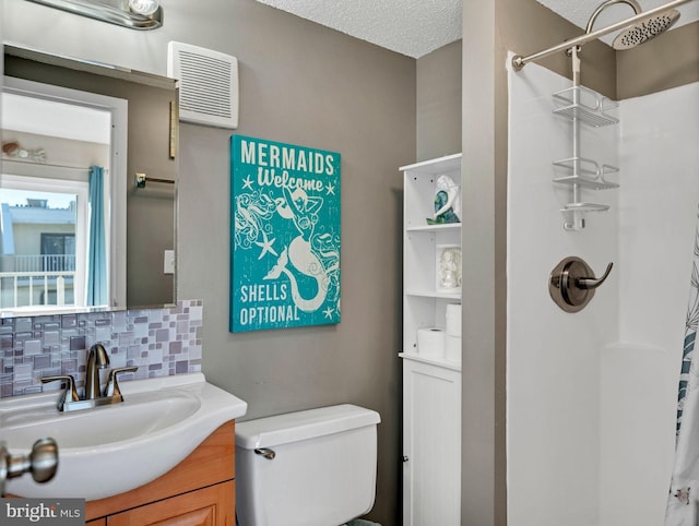 4711 Coastal Hwy Unit 538, Ocean City, MD 21842 - full bathroom featuring tasteful backsplash, a shower with curtain, toilet, vanity, and a textured ceiling