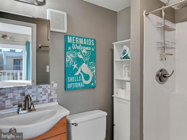 4711 Coastal Hwy Unit 538, Ocean City, MD 21842 - bathroom with tasteful backsplash, toilet, a shower, and vanity