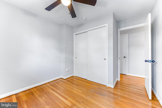 1302 Burlington Dr, Odenton, MD 21113 - unfurnished bedroom featuring a closet, baseboards, light wood finished floors, and ceiling fan
