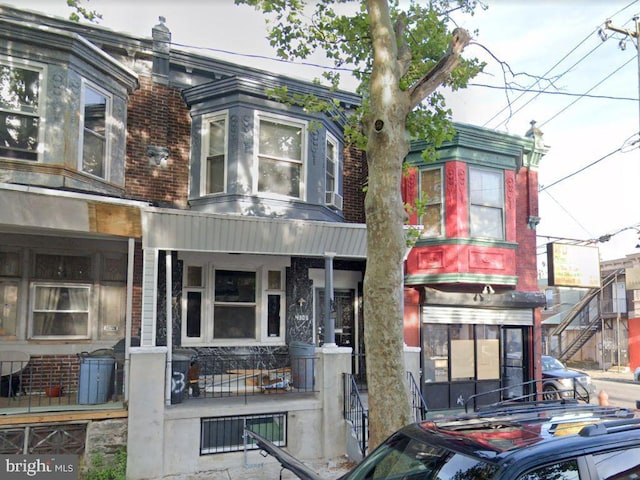 4303 N Franklin St, Philadelphia, PA 19140 - view of front of house featuring covered porch and brick siding