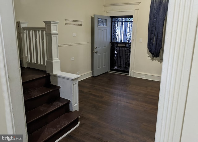 4303 N Franklin St, Philadelphia, PA 19140 - foyer entrance featuring dark wood-style flooring, baseboards, and stairs